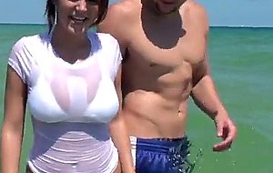 Lisa reveals her big tits at the beach side