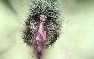 Taking care  of her hairy pussy
