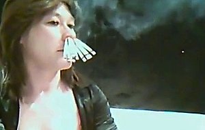 Smoking 10 cigarettes at once with her nose only