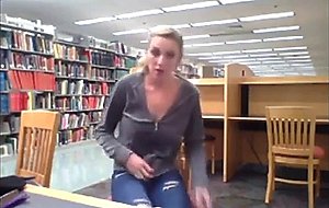 Sandy shows off her tits in public library