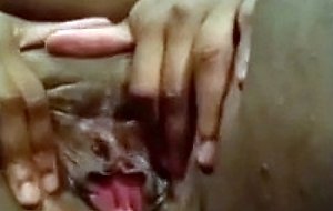 Hot black fattie enjoying rubbing her pussy