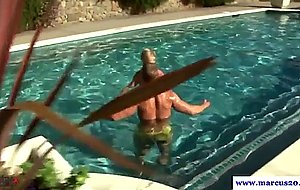 Athletic stud sucking cock in the pool