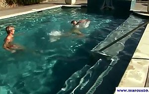 Athletic stud sucking cock in the pool