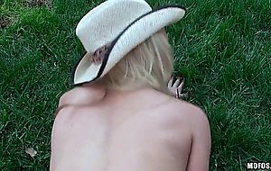 Alix lynx in cowgirl hat gets pounded on a lawn