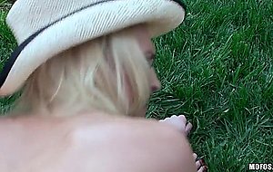 Alix lynx in cowgirl hat gets pounded on a lawn