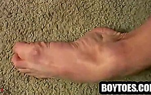 Amateur stud tugs on his cock and shows his feet
