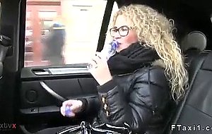 Curly haired blonde fucking in fake taxi in public