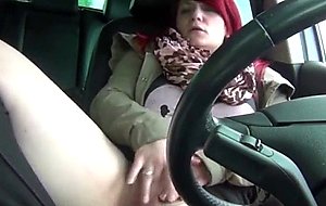 Chunky redhead fingering herself in the car  