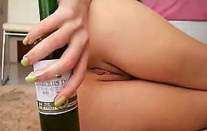 Blond wife stretching her ass with a bottle  