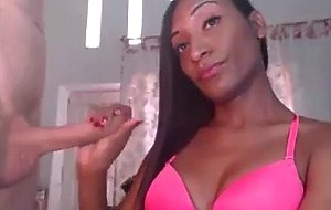 Delicious chocolate shemale stroking her bf's cock  