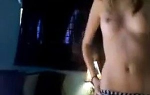 Skinny teen stripping to music