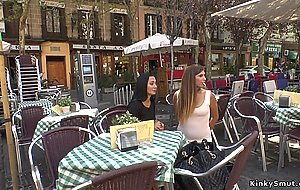 Brunette smoking in public cafe outdoor