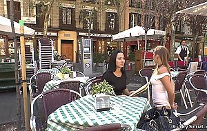 Brunette smoking in public cafe outdoor