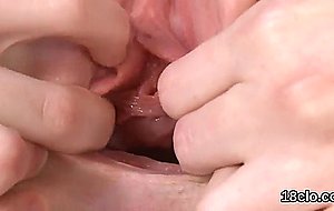 Cuddly teen is opening up slim vagina in close up   