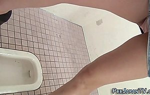 Kinky asian urinating in toilet cam  