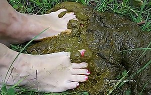 Woman steps barefoot in cowshit  