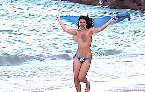 Saggy titties bouncing at the beach