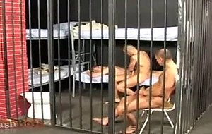 Three male prisoners are passing their time, naked, in the ...
