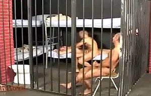 Three male prisoners are passing their time, naked, in the ...