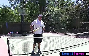 Redhead teen pleasing her coach on the tennis field