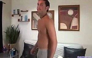 Dark-haired guy pulls out his cock