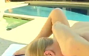 Beautiful bikini clad brunette fucks her blonde gf by the pool
