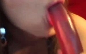 See this chick stick a huge, red vibrator inside her