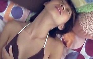 Amateur petite asian babe rubs her pussy
