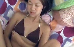 Amateur petite asian babe rubs her pussy