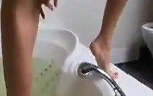 Thin girlfriend playing in a bath tube