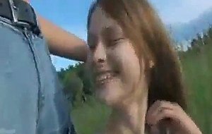 Cute teenie toying pussy in a forest