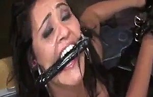 Delicious brunette slut gets a facial during bondage