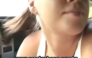 Big tits brunette gives handjob in the car