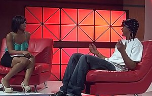 Black couple makes love on red couch