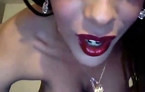Busty tranny strokes her intense cock
