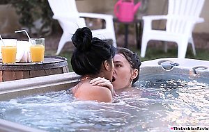 A brunette lesbian babe facesitting her asian girlfriend