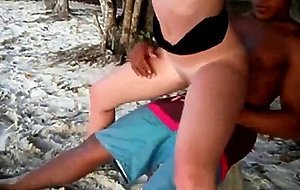 White girl fucks black guy on beach
