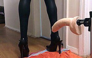 Sissy in chastity getting ready with a big dildo machine