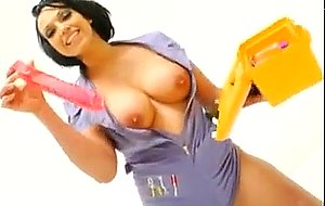 Busty constructor thrusting vibrator in her ass