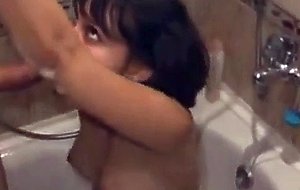 Brunette chick cleans a cock in the shower